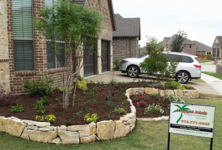 Granbury Builders on house and as flowerbed edging.