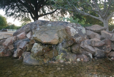 Moss Boulder with a hole drilled through to make a water feature.