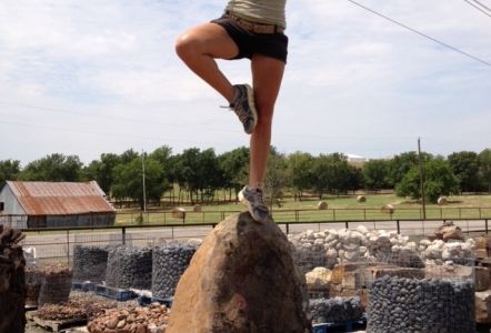 Alyssa balancing on a boulder.