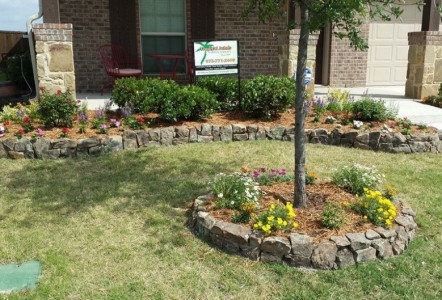Moss Boulder edging installed by Tropical John