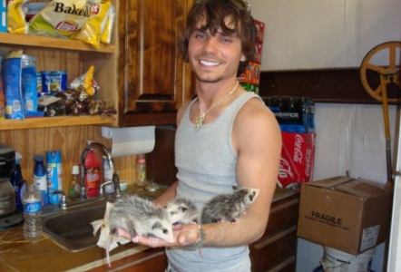 Brody with a batch of orphaned possums.