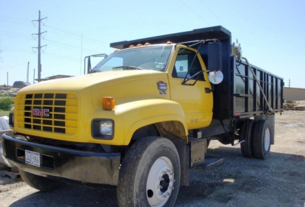 Dump Truck with long bed. We can dump pallets out of this truck.