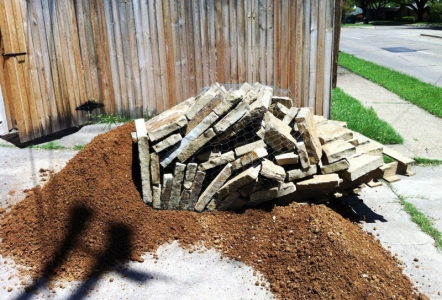 Pallet of chopped flagstone landed on the decomposed granite which came along on the same delivery.