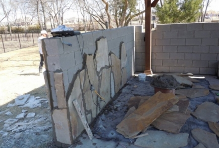 Thin Oklahoma Slabs being layed on a wall.