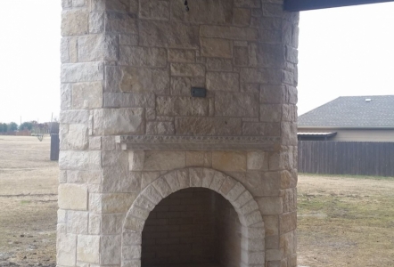 Austin Stone Fireplace with  Lueders Buff Slab used as for the hearth and mantle - built by Texas Outdoor Oasis