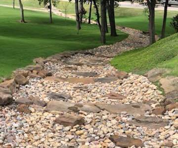 After...The City of Rockwall built a beautiful river bed with our Rainbow River Rock next to City Hall.