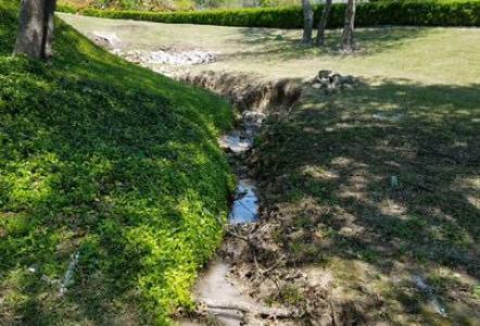 Before...a bit of an eye sore drainage issue next to Rockwall City Hall.