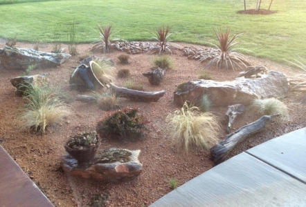 Decomposed Granite, Cherokee River Rock, and Moss Boulders give this landscape a Texas feel.