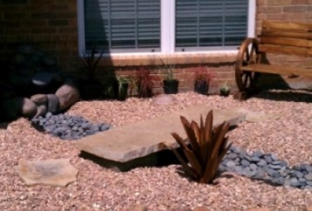 Rock garden including Mexican Beach Pebbles and Cinnamon Gravel