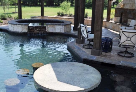 Round Stone Table in a pool