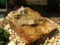 Moss Boulder turned into a fountain.