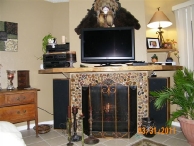 A fireplace jazzed up with chinese polished river rocks!