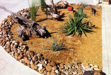 Decomposed Granite & Cherokee River Rock give this landscape a western feel.