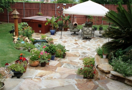 Lovely backyard with lots of stone!