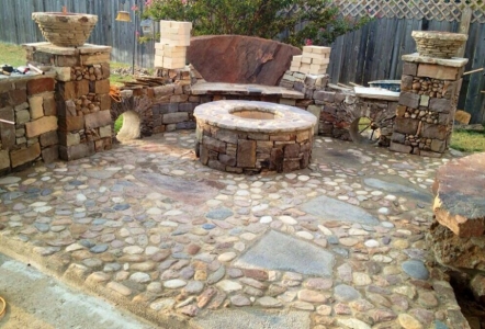 Fire pit sitting area using a variety of different stones.