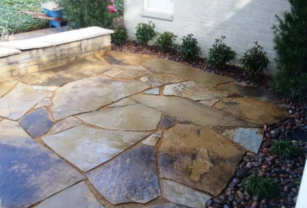 Flagstone patio with Arizona River Rocks around the edges.