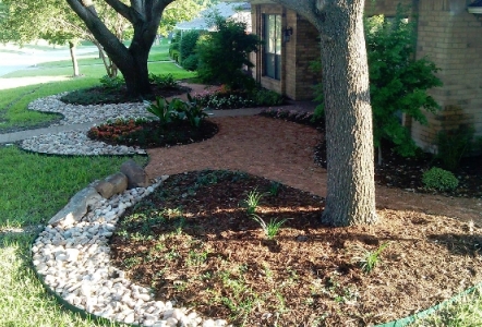 River Rocks lining the beds.